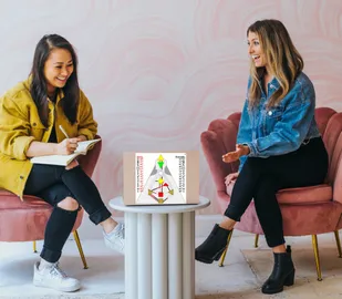 Two women looking at laptop